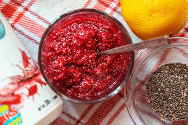 Colorful summer recipe spread featuring refreshing smoothies, vibrant salads, and protein-packed dishes made with Perfect Sports products, styled on a sunny outdoor table.