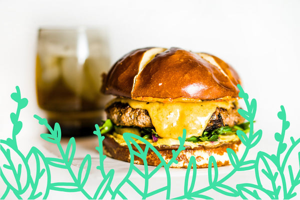 Colorful assortment of innovative dishes representing new food trends to watch out for in 2020, including plant-based meals, fusion cuisine, and sustainable packaging.