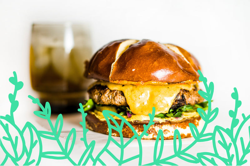 Colorful assortment of innovative dishes representing new food trends to watch out for in 2020, including plant-based meals, fusion cuisine, and sustainable packaging.