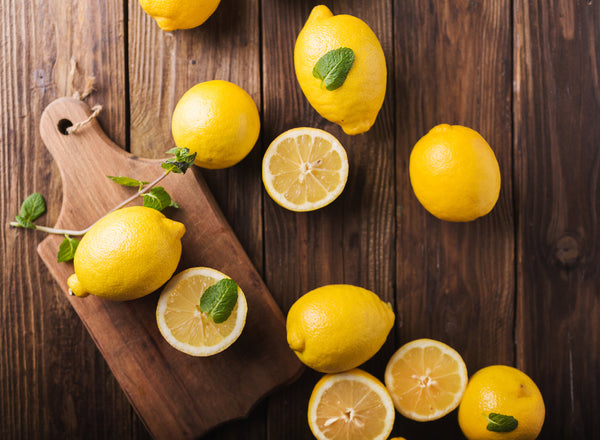 Refreshing homemade lemonade with a bold dark berry infusion in a glass jar.