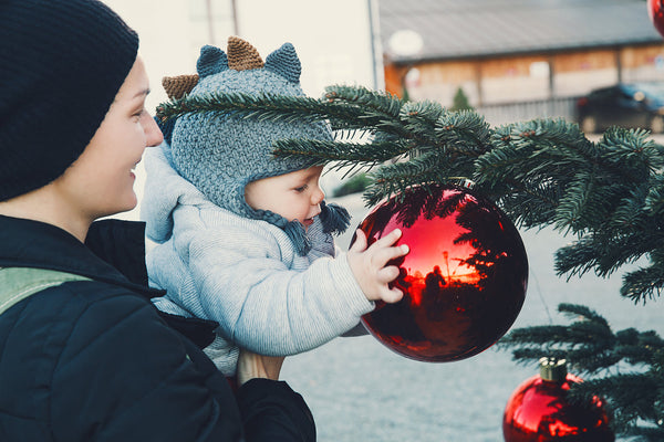 Family gathering around a beautifully decorated Christmas tree celebrating love and togetherness.