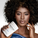 Bottle of Codeage L‑Glutathione laid flat on a light background, with capsules partly spilled out beside it