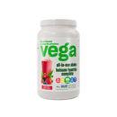 A container of Vega All in One Nutritional Shake in Mixed Berry flavor. The container is white with green and red branding and product information.
