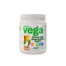 Vega All in One Nutritional Shake Coconut Almond packaging next to fresh coconuts and almond nuts on a wooden table.