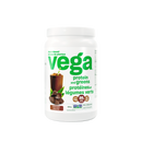 A container of Vega Protein & Greens Chocolate powder, which is a plant-based protein supplement with added greens.