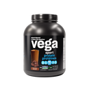 Close-up of a Vega Sport Protein Chocolate flavored powder container with a scoop of protein powder.