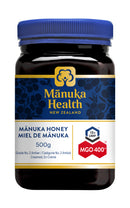 A jar of Mānuka Health New Zealand MGO 400+ Mānuka Honey in a 500g size with product labels visible.