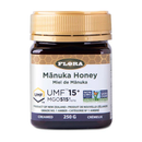 Front view of Flora Manuka Honey 515+ MGO/15+ UMF in a 250g jar with premium black and gold label design.