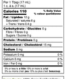 Serving spoon scooping out pure beef tallow suet from a glass container, ideal for high-heat cooking and paleo or carnivore diets.