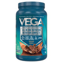 Vega All-in-One Mocha Shake – A vibrant mocha drink on a wooden table, showing off its healthy and tasty ingredients.