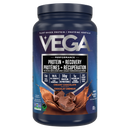 Vega Sport Protein Chocolate powder being mixed into a blender for a post-workout smoothie.