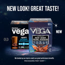 Two Vega protein packaging boxes with text about new look and great taste on a space-themed background.