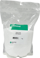 A sealed plastic bag labeled Vitasave Epsom Salt, 1 kg size, predominantly white with green and red accents on the label.