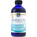 A blue bottle of Nordic Naturals Omega-3 Pet supplement for pets, with a label that includes a white and blue color scheme and an image of a dog.