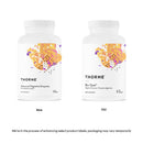 Close-up of Advanced Digestive Enzymes Vcaps capsules spilling out of a bottle, highlighting digestive health support.