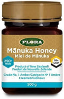 Close-up of Flora Manuka Honey 10+ UMF label on a dark amber jar, emphasizing its high MGO rating and certified potency.