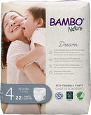 Packaging of Bambo Nature Training Pants with an image of an adult hugging a child, indicating comfort and care. The package mentions the product is eco-friendly, has up to 10 hours of protection, and weighs 15-31 lbs.