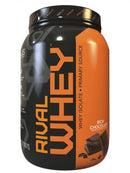 A container of Rivalus Rival Whey Protein Powder in Rich Chocolate flavor. The container is predominantly black with orange accents and displays the product name and chocolate imagery on the front.