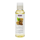 Bottle of NOW Sweet Almond Oil on a wooden surface, showcasing its natural and pure oil for skincare and hair care.